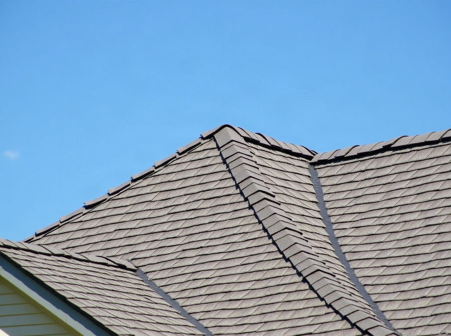 A shingle-over ridge vent running along the peak of a roof