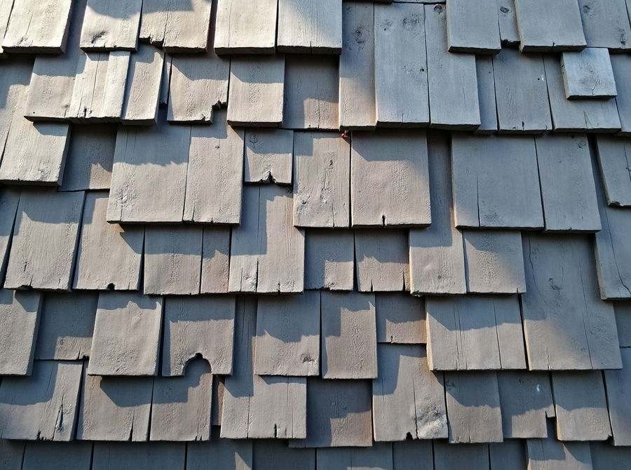 Split cedar shakes weathered to silver-grey on a pitched roof
